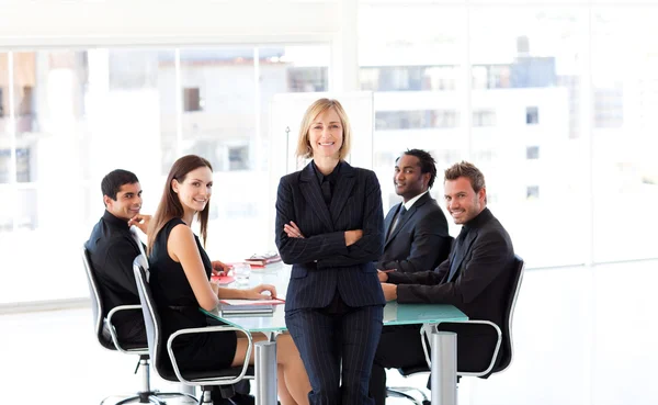 International business team smiling at the camera in a meeting — Stock Photo, Image
