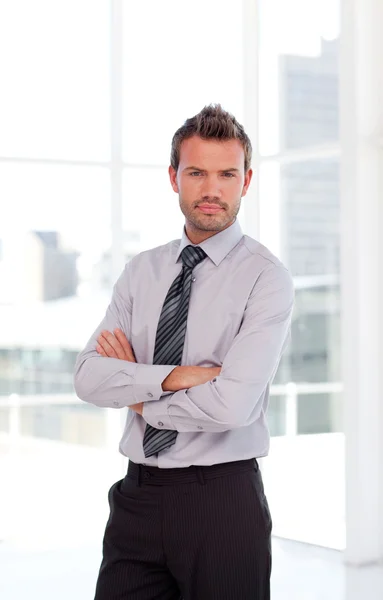 Serious businessman with folded arms — Stock Photo, Image
