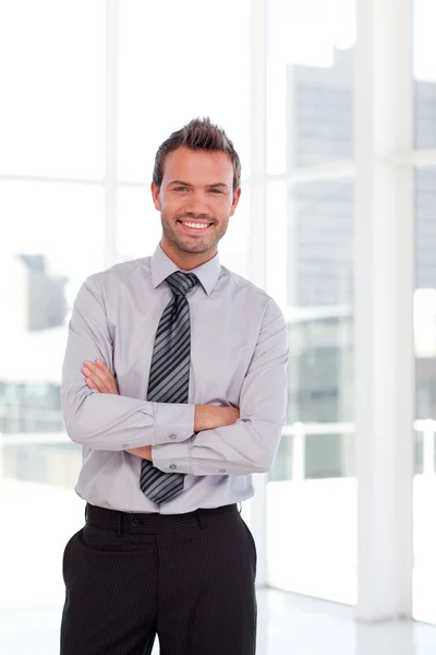 Handsome businessman with folded arms — Stock Photo, Image