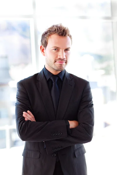 Attractive confident businessman with folded arms — Stock Photo, Image