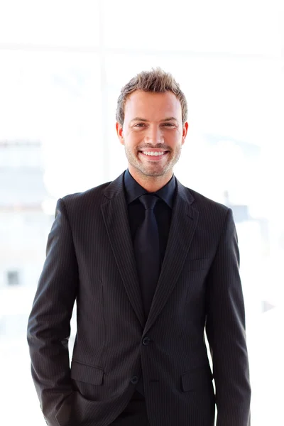 Young businessman smiling at the camera — Stock Photo, Image