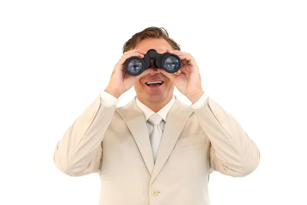 Smiling businessman looking through binoculars — Stock Photo, Image