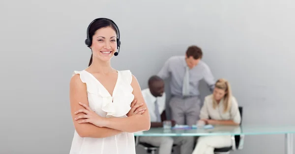 Attractive businesswoman with a headset on — Stock Photo, Image