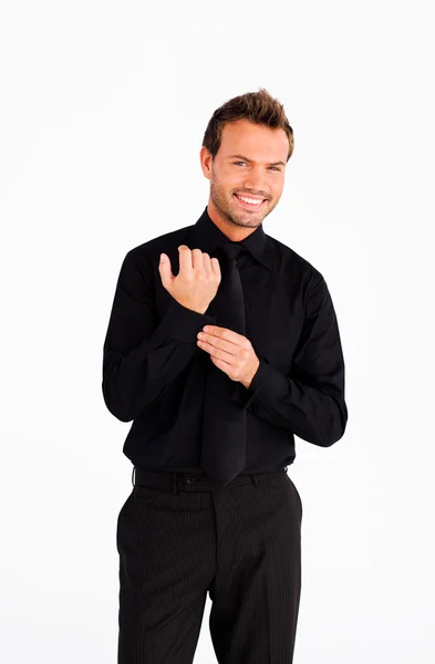 Handsome businessman corrects a cuff link — Stock Photo, Image