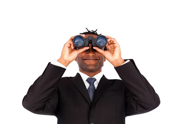 Handsome afro-american businessman holding binoculars upwards — Stock Photo, Image