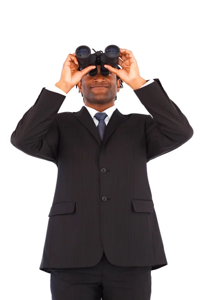 Serious afro-american businessmanmanager using binoculars — Stock Photo, Image