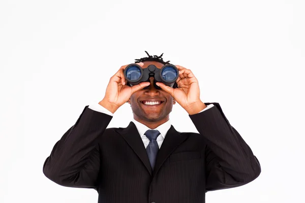 Handsome businessman holding binoculars upwards — Stock Photo, Image