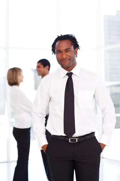 Happy businessman in the office with his team — Stock Photo, Image