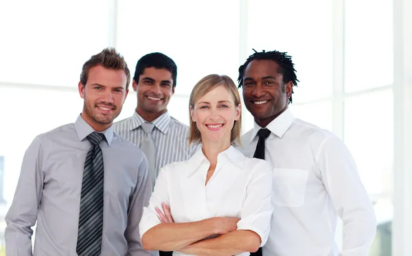 Confident business team smiling at the camera Royalty Free Stock Images