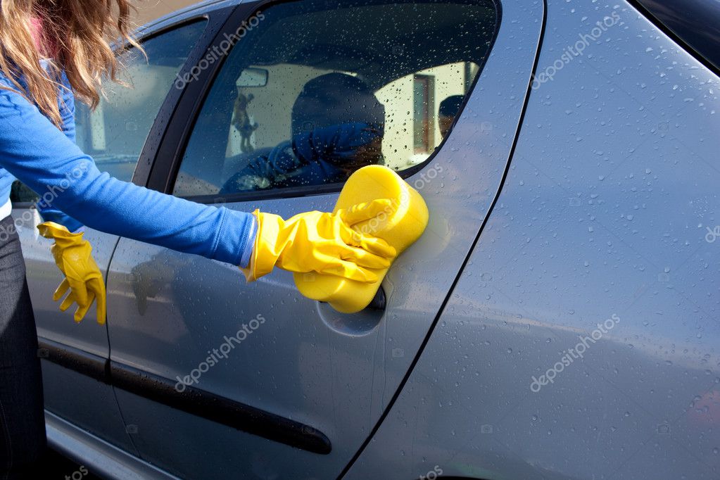 Closeup of a woman cleaning her car — Stock Photo © Wavebreakmedia