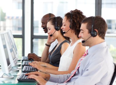 Young businesswoman working in a call center clipart