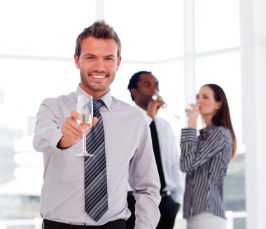 Businessman drinking champagne and celebrating a success clipart