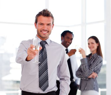 Handsome businessman celebrating a success clipart