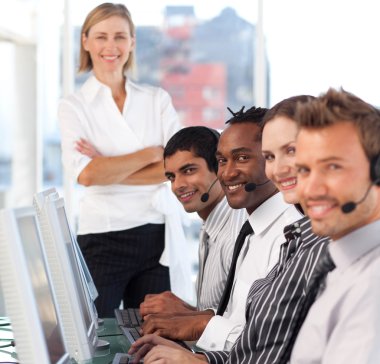 Happy team in a call center clipart