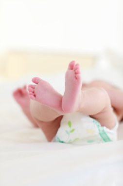 Baby resting in bed clipart