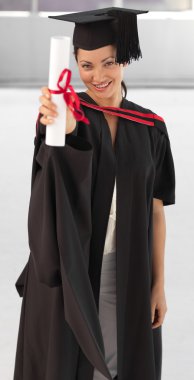 Young woman Graduating holding her Diploma clipart