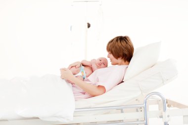 Mother with her newborn baby clipart