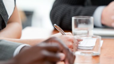 Close-up of a business team listenning a meeting clipart