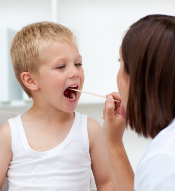 Close-up of a doctor examining patient's throat clipart