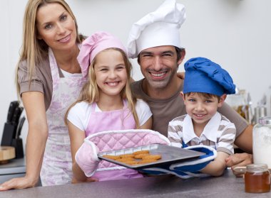 Family baking cookies in the kitchen clipart