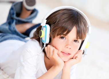 Liitle boy listenning music clipart