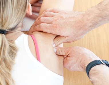 Young woman having a massage clipart