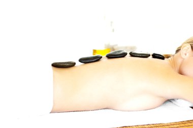 Young woman having a massage clipart