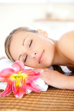 Portrait of a delighted woman having a massage clipart