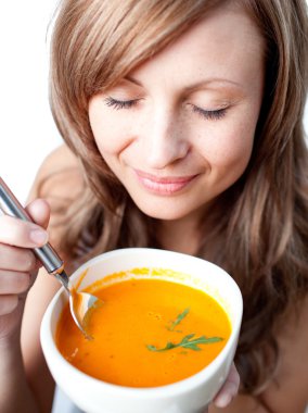 Delighted woman holding a soup bowl clipart