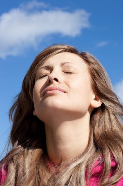 Delighted woman is relaxing outdoor clipart