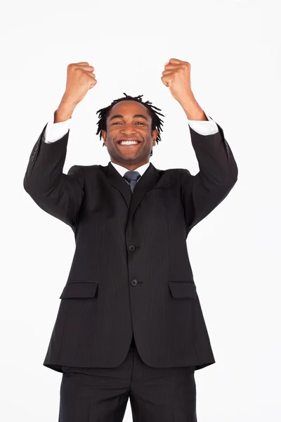 Smiling businessman with raised arms — Stock Photo, Image