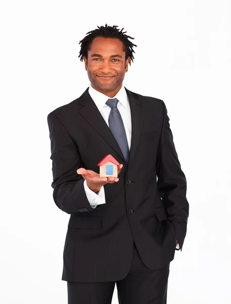 Afro-american businessman presenting house — Stock Photo, Image