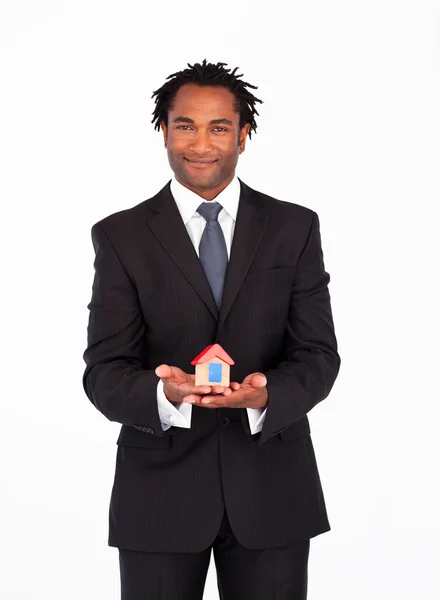 Afro-american businessman presenting a house — Stok fotoğraf