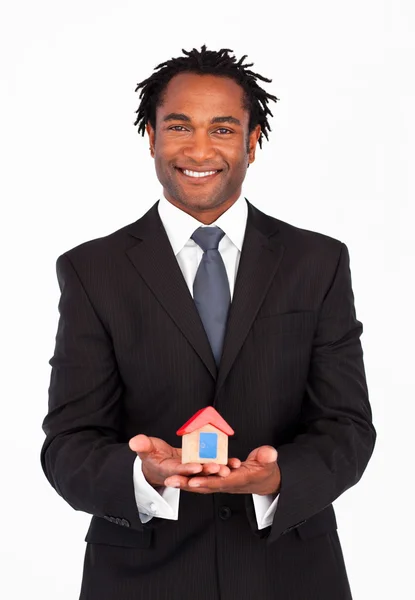 Friendly businessman showing constructions of house — Stock Photo, Image