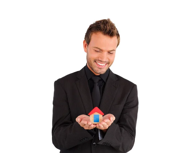 Young male business manager presenting house solution — Stock Photo, Image