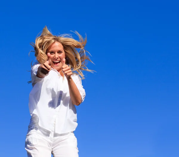 Beautiful woman jumping in the air — Stock Photo, Image