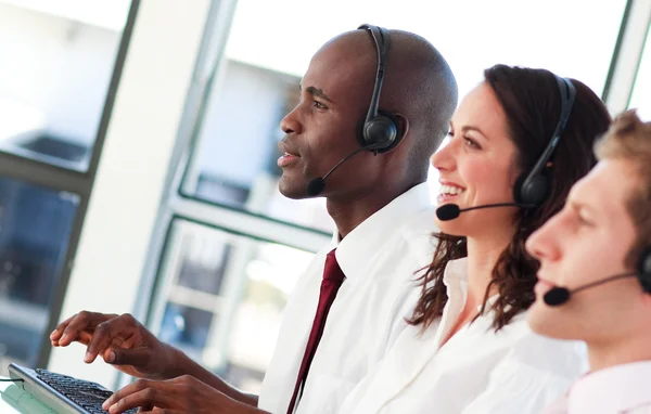 Delighted with a headset on working — Stock Photo, Image