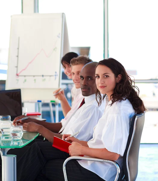 Business in an office looking at the camera — Stock Photo, Image