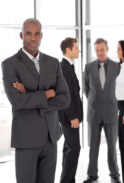 Young Businessman standing out from the Crowd — Stock Photo, Image