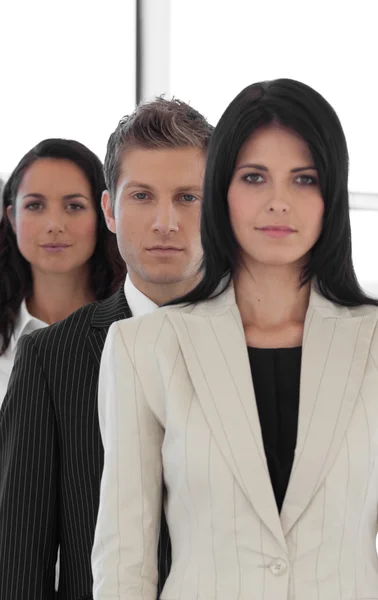 Beautiful young businesspeople in a row — Stock Photo, Image