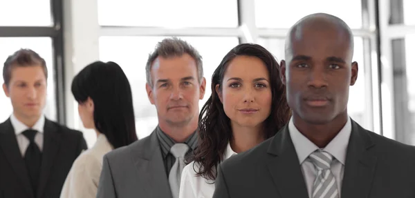 Serious business leader in front of business team — Stock Photo, Image