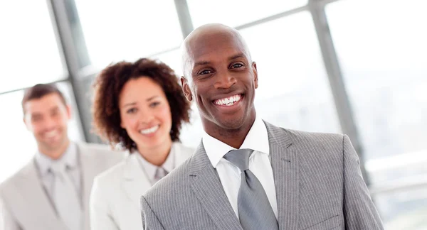 Smiling businessman in a row — Stock Photo, Image