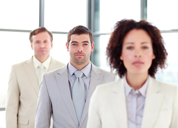 Young confident businessman with his team — Stock Photo, Image