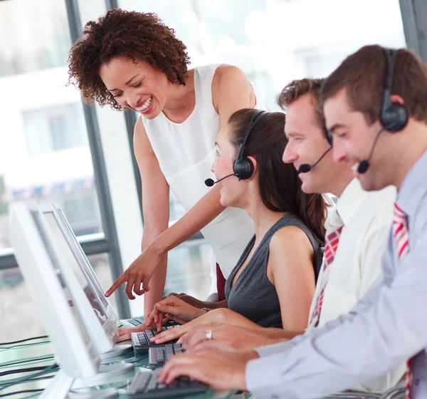 Smiling business partners working with their manager — Stock Photo, Image