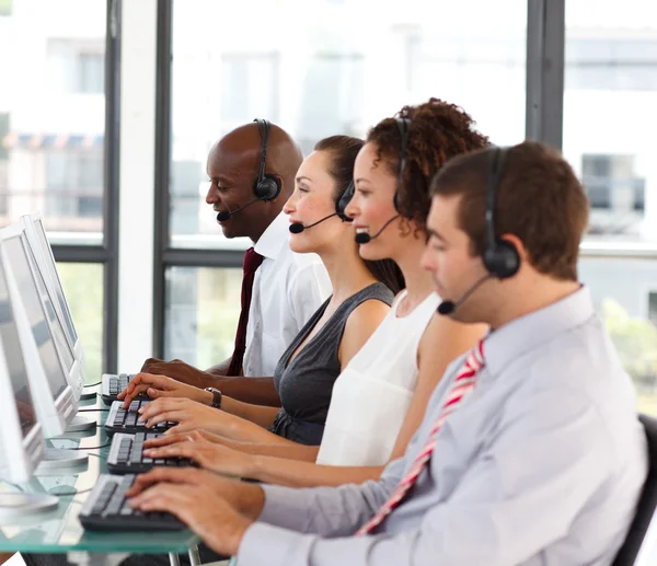 Attractive African-American businessman in a call center — Stock Photo, Image