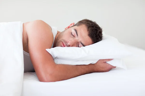 Man sleeping in bed — Stock Photo, Image