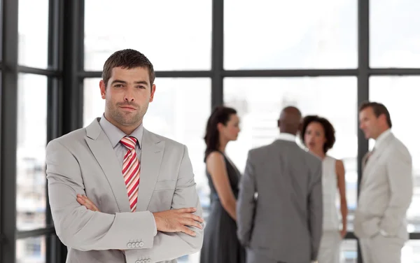 Young businessman being Positive with team in Background — Stock Photo, Image