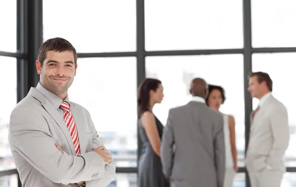 Charismatic businessman with his team — Stock Photo, Image