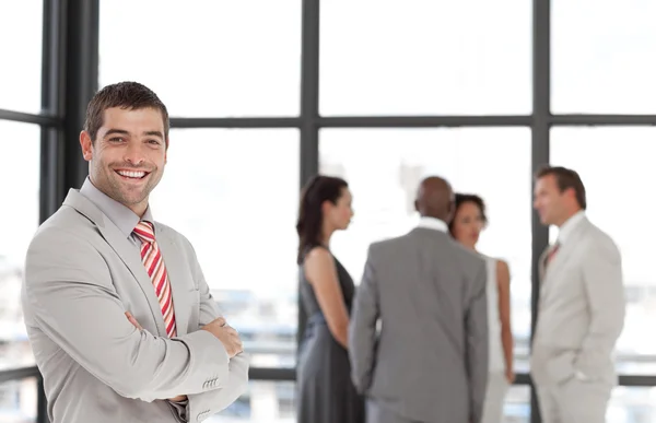 Charismatic businessman with his team — Stock Photo, Image