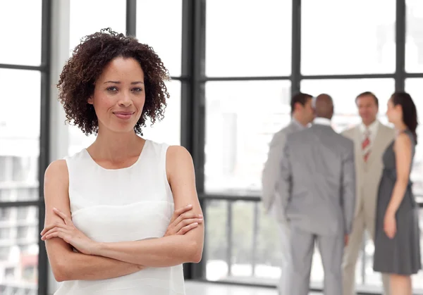 Attractive businesswoman in office with her team — Stock Photo, Image